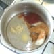 Onion, garlic and spices are added to hot sunflower oil