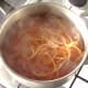 Poaching egg noodles in turmeric water