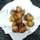 Roast potatoes are drained and seasoned