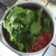 Spinach is added to chicken curry