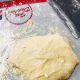 The next day, transfer the dough to a floured surface or baking mat.