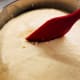 Gently, poke the dough to let the air out.