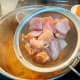 When the the water comes to a boil, add the chicken.