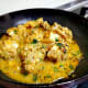In a pan, add butter. When it starts melting, add the marinated chicken and stir well.