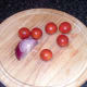 Cherry tomatoes and quarter red onion