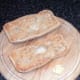 Garlic is rubbed on toasted panini halves