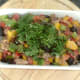 Coriander is stirred through sardine combination