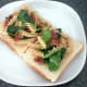 Infused fusilli pasta is arranged on toast