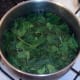 Spinach is blanched in boiling salted water