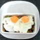 Fried eggs are laid on sardine combination