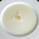 Garlic is grated in to olive oil