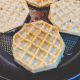 Put the coated waffle in the pan.