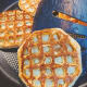 Remove the cooked waffles from the pan and continue cooking the remaining waffle.