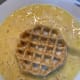 Take the first waffle and dip it in the batter thinly.