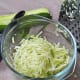 Shred the zucchini with a grater.
