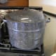 Fill waterbath canner with water to cover filled jars by one inch, and set on to boil. (The stockpots are full of other things I was cooking.)