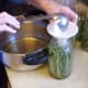 Ladle the hot solution over the beans, leaving 1/4-inch headspace. Remove air bubbles by running the spatula around the inside of the jar. Air can cause spoilage. Put on lids fairly tightly. (I used cider vinegar for this batch, as I ran out of white