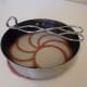 Set lids in a small pan and pour scalding water over them, or simmer them slowly in a saucepan of water. DO NOT BOIL! Leave them in the water until you use them.