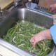 Wash in cold water, swishing them about to dislodge dirt and other matter.