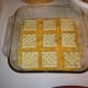 Second layer of crackers, on top of soup and cheese.