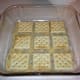 The first layer of crackers.