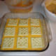 Third layer of crackers, with a heavier layer of cheese underneath.