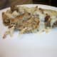 Chicken and dressing casserole with gravy.
