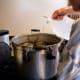 Add a splash of vinegar, to avoid hard water stains on your canner and jars.