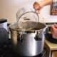 Pour into your pressure canner the recommended amount of water (usually 2 quarts), and begin heating it.