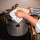 DO NOT REMOVE WEIGHT YET. Once the pressure gauge has returned to zero pounds, carefully remove the weight and lid of your canner. Unscrew knobs in opposites, just like you tightened them.