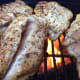 fire up the grill and start cooking it