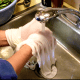 There should be nothing visible left in the towels when you are through rinsing them. But they will still smell of milk, perhaps ever after.