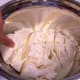 Slice the ball into thick pieces, or if it is a small ball, into halves. Salt the pieces.