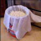 Drain the cheese over a colander lined with a tea-towel draped into it, fitted into a 5-gallon bucket.