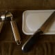 Garlic Press? Cutting board and broad knife.