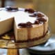 Spiced Pumpkin Cheesecake with Caramel-Bourbon Sauce