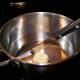 Over low heat, melt butter in a pan.