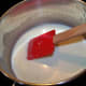 Add milk and stir, turning up the heat to medium. Stir constantly until the mixture boils and thickens.