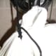 Knotting details on the bag. The corners of the bag are gathered together, and the shoelace is knotted around the "neck" at least three times.