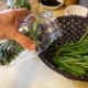 Lay the beans in close together. If you have broken them in pieces, you may wish to use a large-mouth funnel to help get them in the jars.