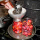 Ladle hot syrup into each jar to cover plums, leaving 1/2" headspace.