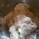 The dough will be rough at first. If it doesn't come together after a minute add a tablespoon of water.