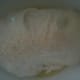 The dough goes into an oiled bowl to rise.