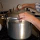 Put on lid tightly. For lids with knobs, tighten two knobs at a time, in opposite pairs, to keep pressure even.
