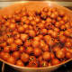 Simmer medlars until soft.