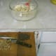 Nuts are chopped and chocolate square sliced into chunks
