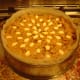Decorate the top with almonds and put the cake into a very cool oven.