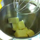 Beat butter until creamy. In this picture I started out with the whipping attachment and then switched to the paddle, which worked much better.
