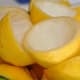 Step 1: Prepare the lemons. (Juiced lemon halves with pulp removed, ready for candying.)