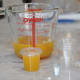 Step 5: Prepare the juice for storage. (Lemon juice now concentrated down to 200 mL from the original 1.2 litres. Packed into small plastic thimbles for freezing. These are the "thimbles" used in food service for sauces. )